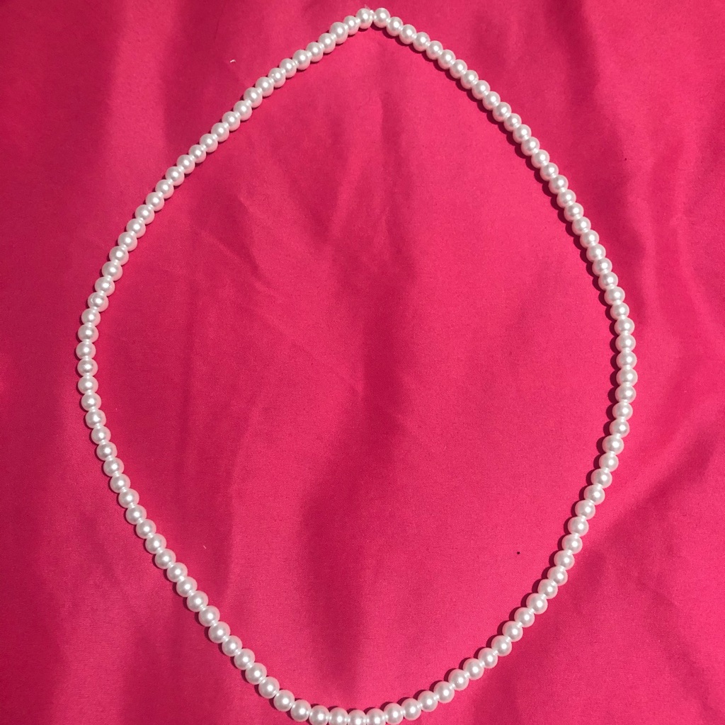 Simple pearl-look necklace photographed for a marketplace listing